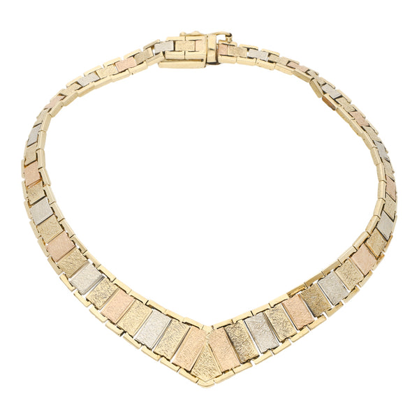 Pulsera eslabón articulado en oro tres tonos 14 kilates.