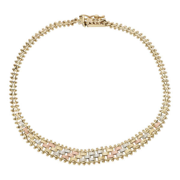 Pulsera eslabón boleado en oro tres tonos 14 kilates.