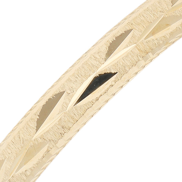 Pulsera de arillo labrada en oro amarillo 14 kilates.