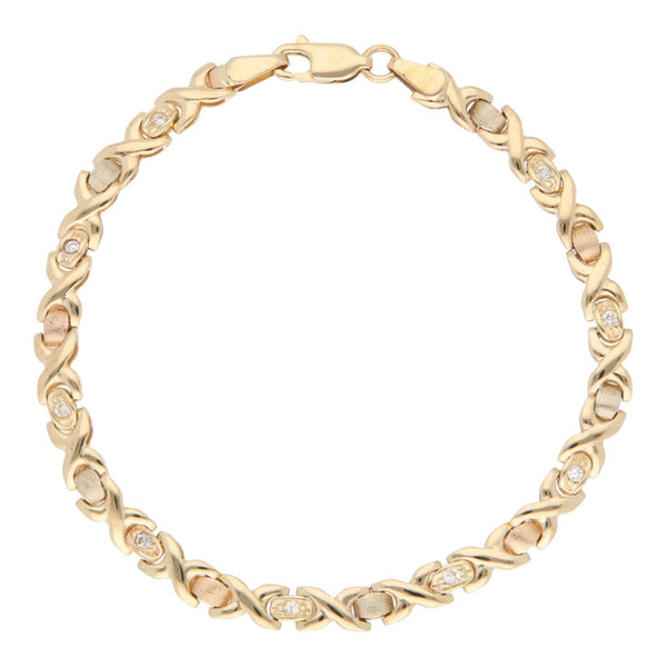Pulsera eslabón XOXO con circonias en oro tres tonos 14 kilates.