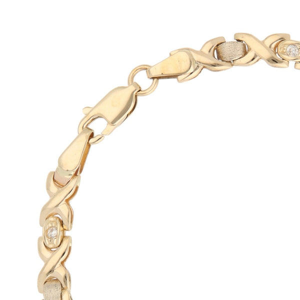 Pulsera eslabón XOXO con circonias en oro tres tonos 14 kilates.