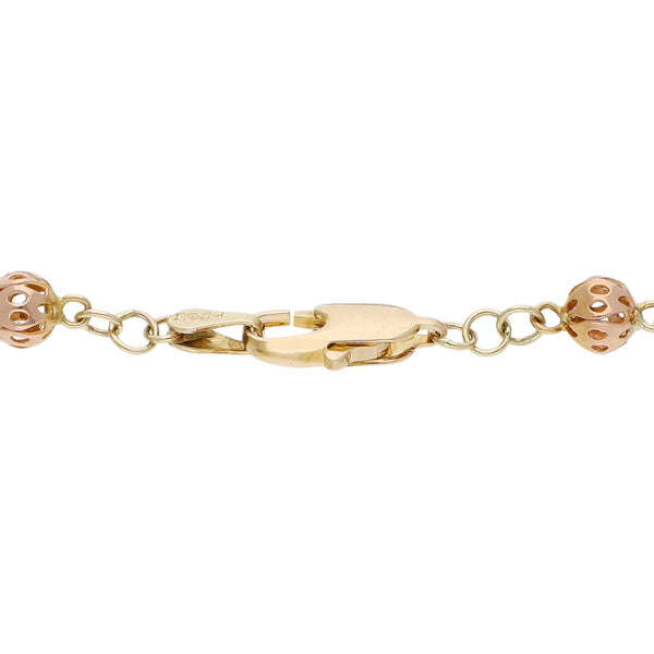 Pulsera tipo rosario eslabón cruzado en oro tres tonos 14 kilates.