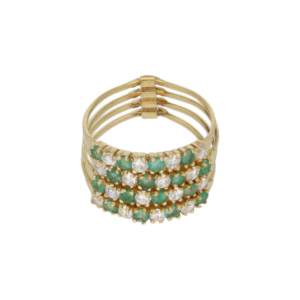Anillo diseño especial con sintéticos y esmeraldas en oro amarillo 18 kilates.