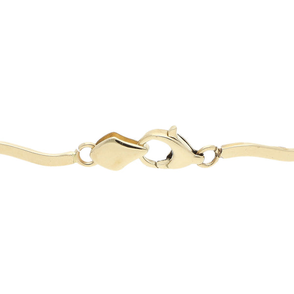 Pulsera eslabón articulado con sintéticos en oro amarillo 14 kilates.