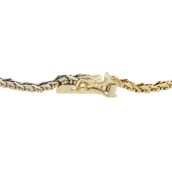 Pulsera eslabón boleado en oro tres tonos 14 kilates.