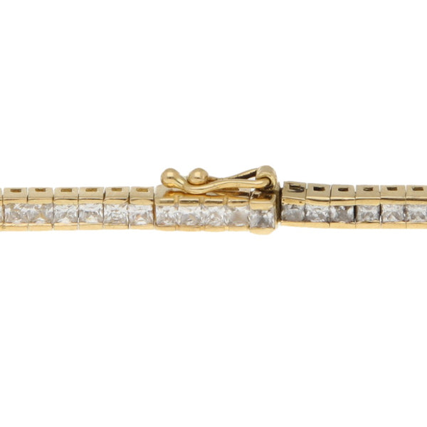 Pulsera eslabón articulado con sintéticos en oro amarillo 18 kilates.