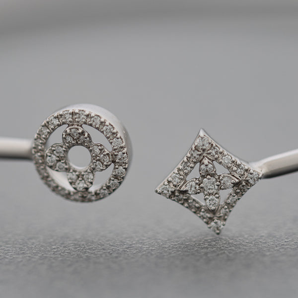 Pulsera de arillo abierta con diamantes en oro blanco 14 kilates.