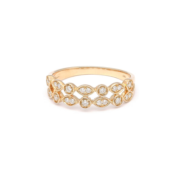 Anillo calado con diamantes en oro amarillo 14 kilates.