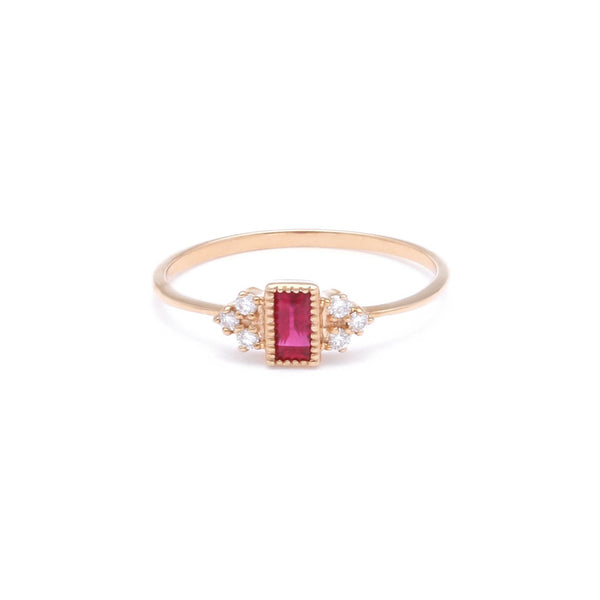 Anillo diseño especial con diamantes y rubí en oro rosa 14 kilates.