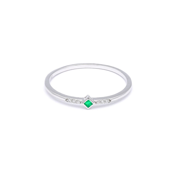 Anillo diseño especial con diamantes y esmeralda en oro blanco 14 kilates.