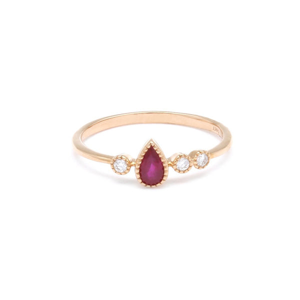 Anillo diseño especial con diamantes y rubí en oro rosa 14 kilates.
