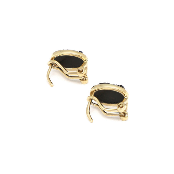 Aretes diseño especial con ónix motivo camafeo en oro amarillo 14 kilates.