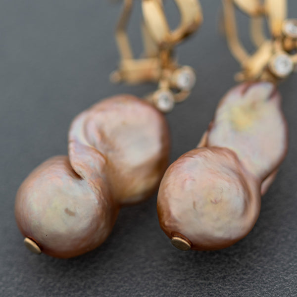 Aretes diseño especial con perlas y circonias en oro amarillo 14 kilates.