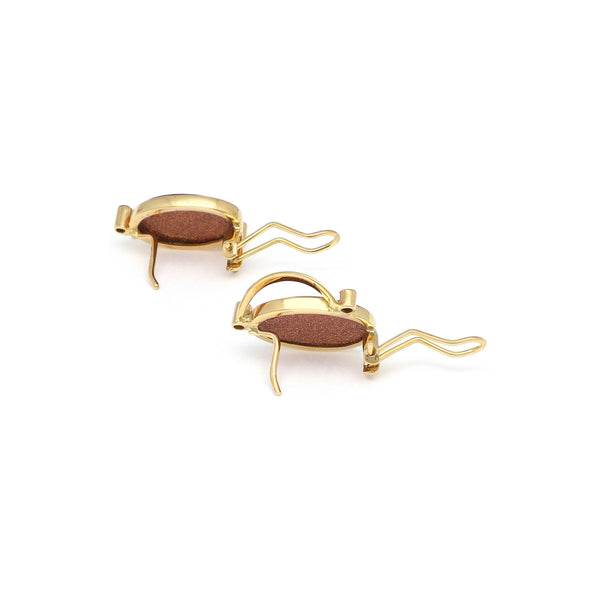 Juego anillo y aretes diseño especial con venturinas y circonias en oro amarillo 14 kilates.