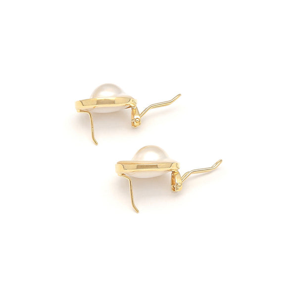 Juego anillo y aretes diseño especial con media perla en oro amarillo 14 kilates.