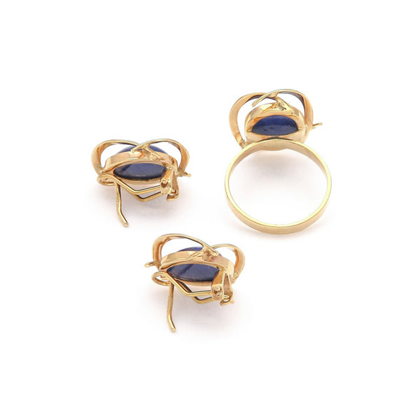 Juego de anillo y aretes calados con zafiro estrella en oro amarillo 14 kilates.