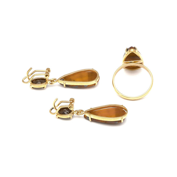 Juego de anillo y aretes diseño especial con ojo de tigre y topacio en oro amarillo 14 kilates.