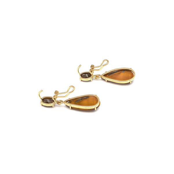 Juego de anillo y aretes diseño especial con ojo de tigre y topacio en oro amarillo 14 kilates.