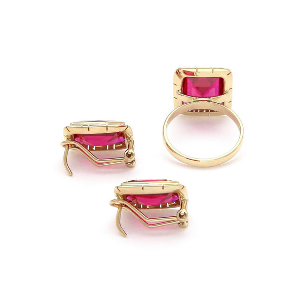 Juego anillo y aretes calados con rubíes en oro amarillo 14 kilates.