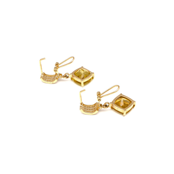 Aretes diseño especial con colgante de citrinos y circonias en oro amarillo 14 kilates.