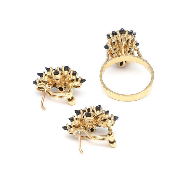 Juego anillo y aretes diseño especial con zafiros en oro amarillo 14 kilates.