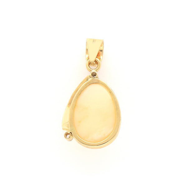 Dije diseño especial con ópalo y circonias en oro amarillo 14 kilates.