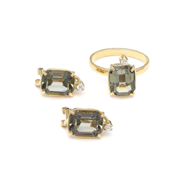 Juego de anillo y aretes diseño especial con circonia y topacio en oro amarillo 14 kilates.