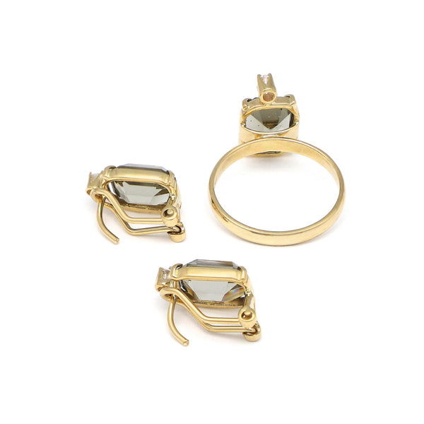 Juego de anillo y aretes diseño especial con circonia y topacio en oro amarillo 14 kilates.