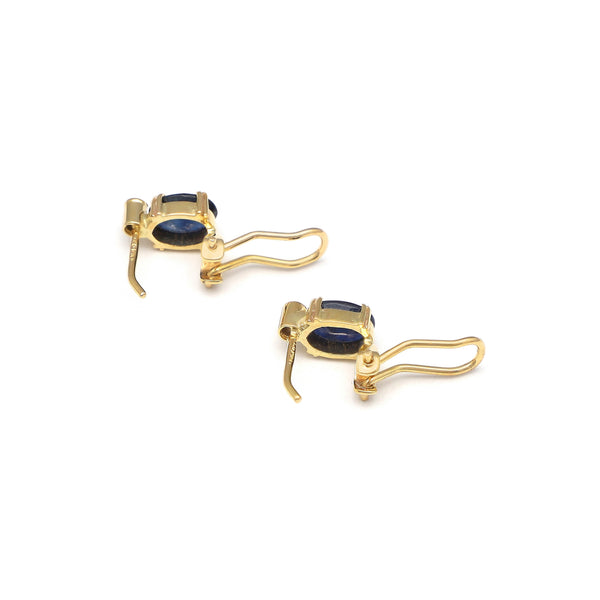 Juego de anillo y aretes diseño especial con zafiro y cirnonia en oro amarillo 14 kilates.