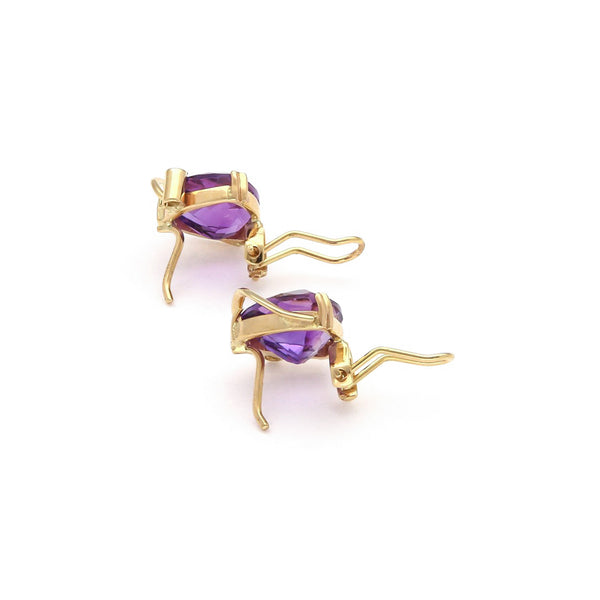 Juego de aretes y anillo diseño especial con amatistas y circonias en oro amarillo 14 kilates.