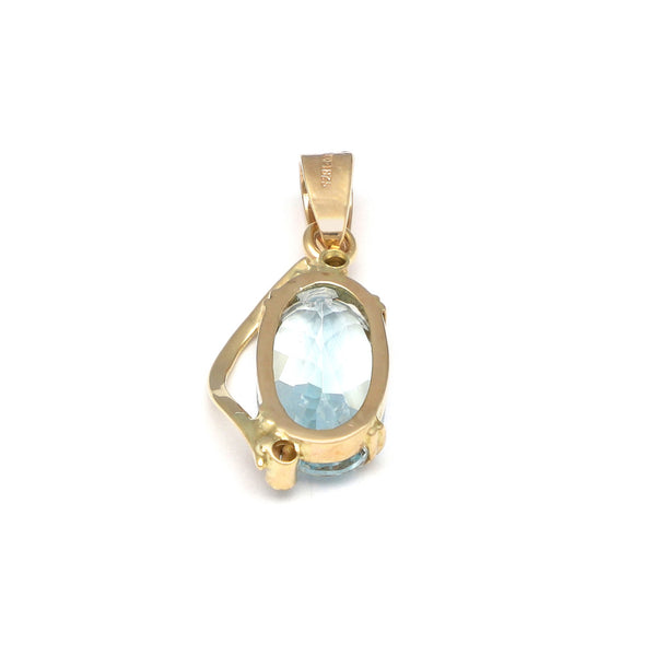 Dije diseño especial con aguamarina y corconias en oro amarillo 14 kilates.
