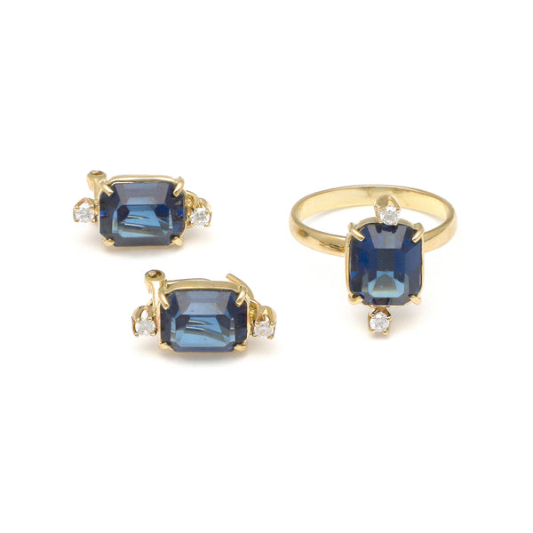 Juego de anillo y aretes diseño especial con circonia y London blue en oro amarillo 14 kilates.