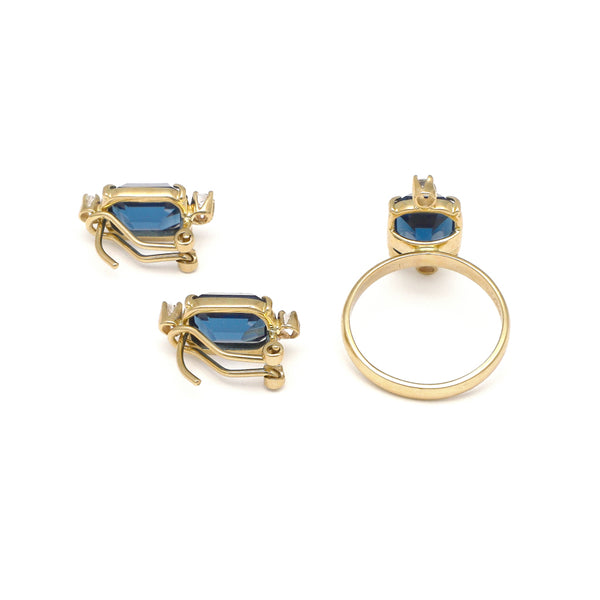 Juego de anillo y aretes diseño especial con circonia y London blue en oro amarillo 14 kilates.