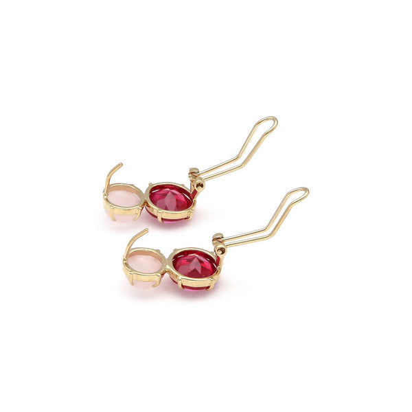 Juego de anillo y aretes diseño especial con rubíes y piedra lunar en oro amarillo 14 kilates.