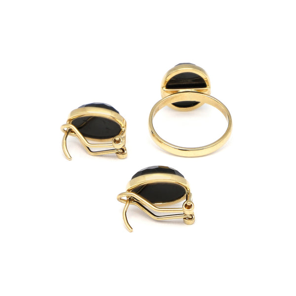 Juego de anillo y aretes diseño especial con ónix en oro amarillo 14 kilates.