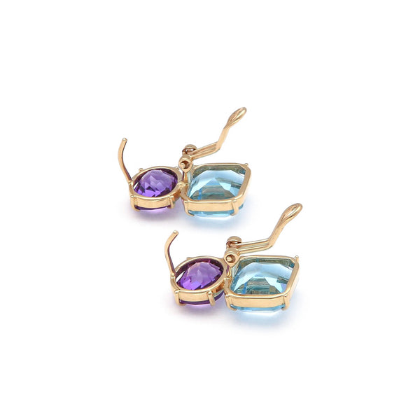 Juego de anillo y aretes diseño especial con amatista y topacio en oro amarillo 14 kilates.
