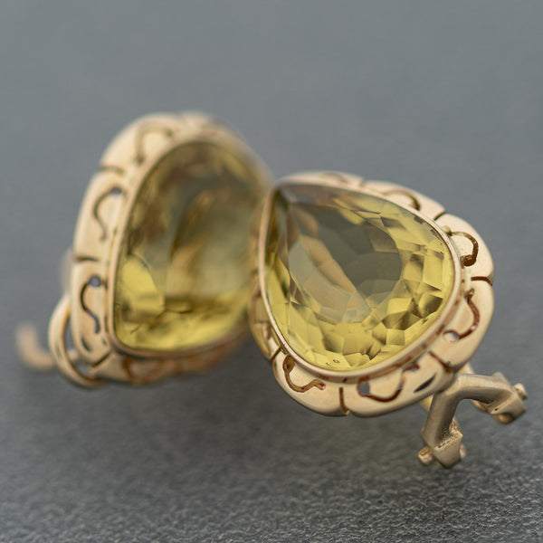 Aretes calados con citrinos en oro amarillo 14 kilates.
