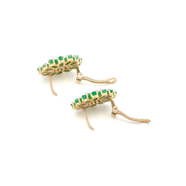 Juego de aretes y anillo calado con esmeraldas en oro amarillo 14 kilates.