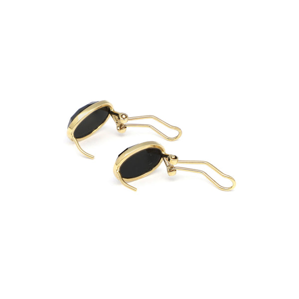 Juego de anillo y aretes con onix en oro amarillo 14 kilates.