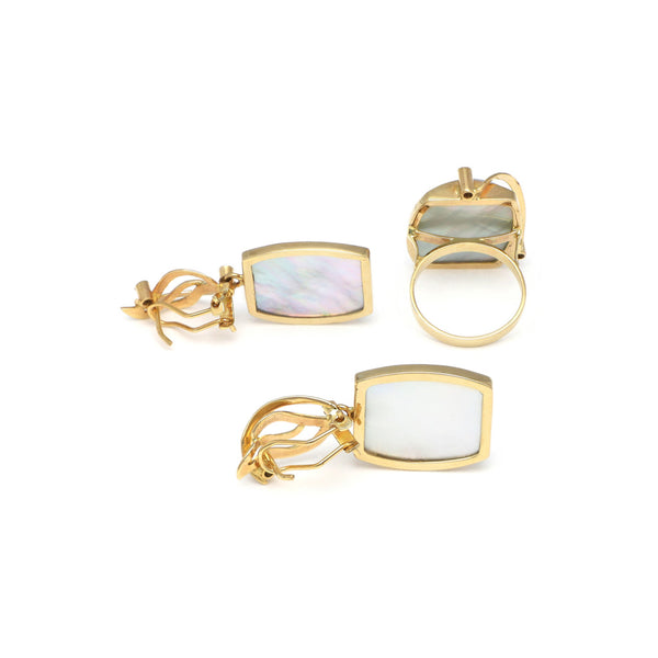 Juego anillo y aretes diseño especial con colgantes de osmeñas y circonias en oro amarillo 14 kilates.