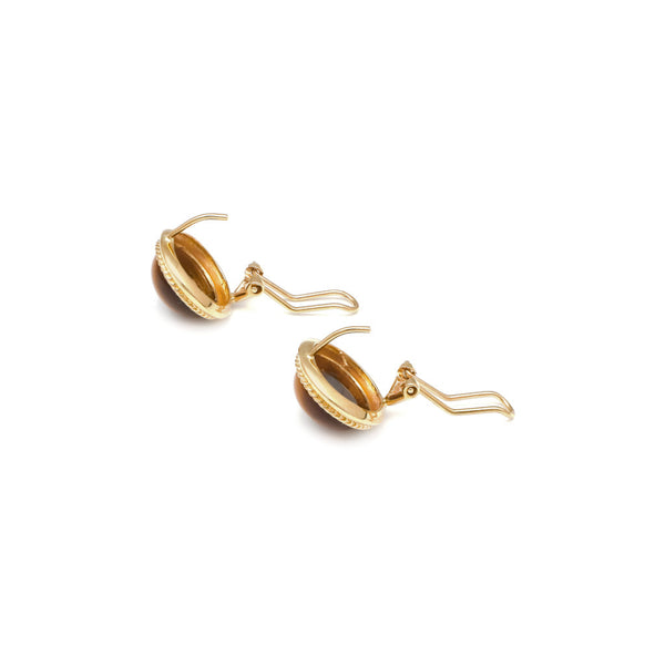 Juego de anillo y aretes diseño especial con ojo tigre en oro amarillo 14 kilates.