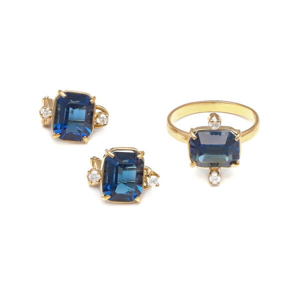 Juego de anillo y aretes diseño especial con blue London y circonias en oro amarillo 14 kilates.