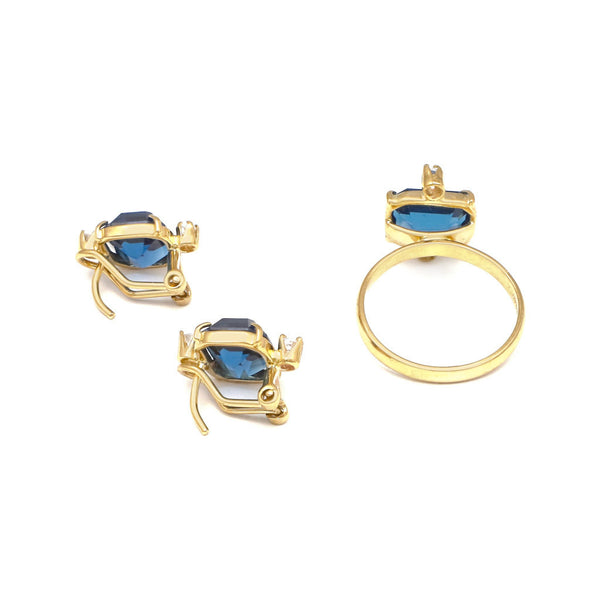 Juego de anillo y aretes diseño especial con blue London y circonias en oro amarillo 14 kilates.