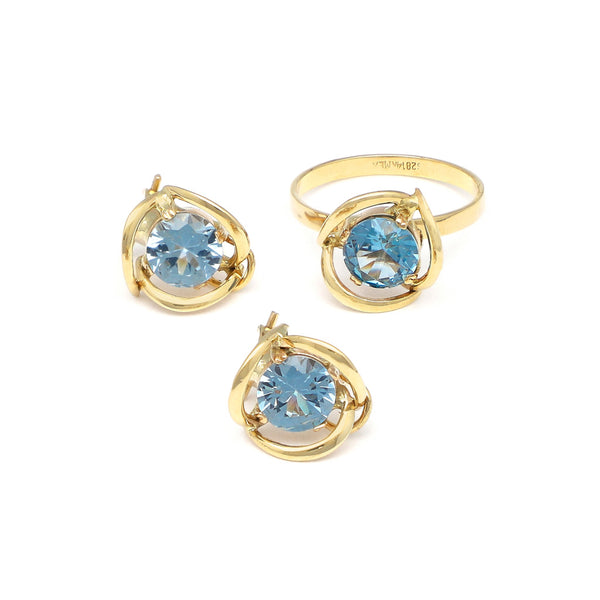 Juego de anillo y aretes calados con aguamarina en oro amarillo 14 kilates.