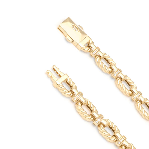 Pulsera eslabón combinado con circonias en oro amarillo 14 kilates.