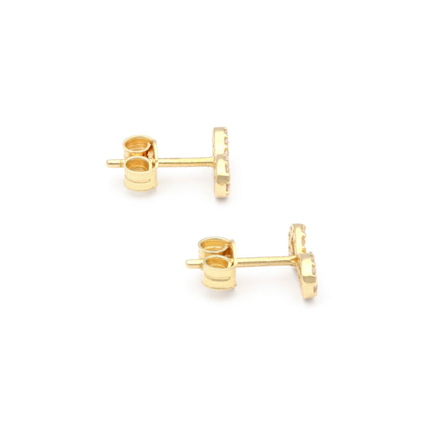 Aretes diseño especial con circonias motivo infinito en oro amarillo 14 kilates.