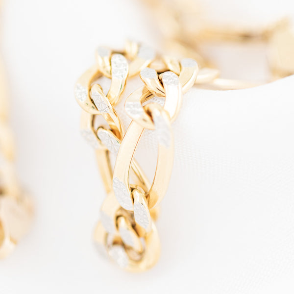 Pulsera de tres eslabones por uno platinados en oro amarillo 14 kilates.