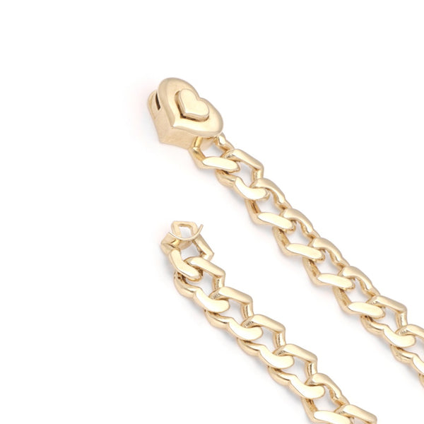Pulsera eslabón encontrado motivo corazón en oro amarillo 14 kilates.