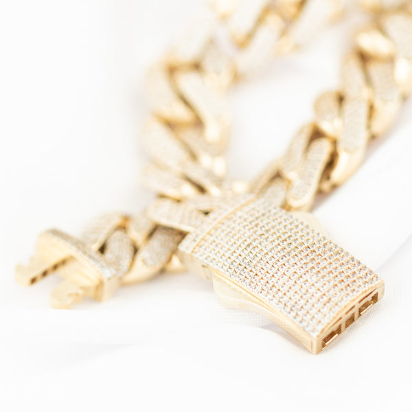 Pulsera eslabón barbado con circonias en oro amarillo 14 kilates.