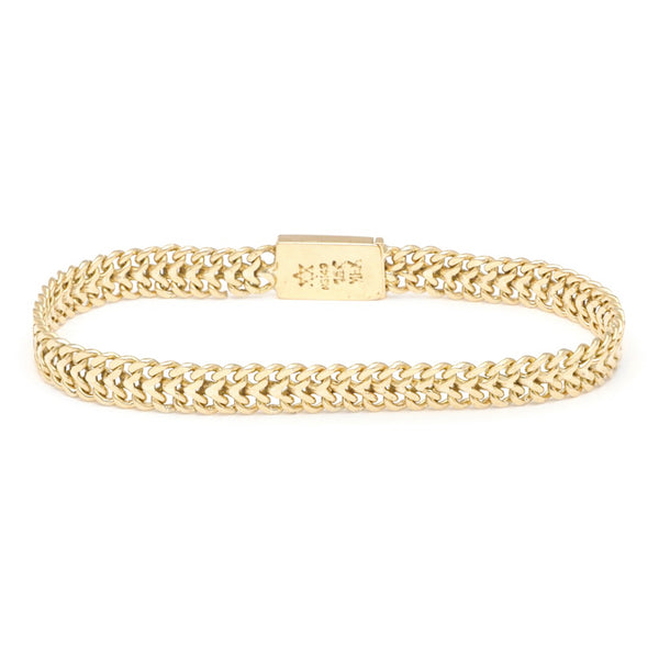 Pulsera eslabón tejido en oro amarillo 14 kilates.